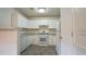 Kitchen featuring white cabinets, stone countertops, and stainless appliances at 11854 Registry Blvd, Hampton, GA 30228