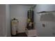 Utility room featuring water heaters and shelving at 11854 Registry Blvd, Hampton, GA 30228