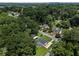 Areal view of a home surrounded by lush greenery and mature trees in a peaceful, residential neighborhood at 1048 Pinehurst Se Dr, Smyrna, GA 30080