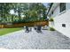Backyard with patio featuring multiple chairs and seating for outdoor entertaining at 1048 Pinehurst Se Dr, Smyrna, GA 30080