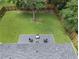 Aerial view of a large backyard with green lawn and a firepit area at 1048 Pinehurst Se Dr, Smyrna, GA 30080