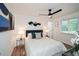 Bright bedroom featuring a comfortable bed and large windows with views to exterior at 1048 Pinehurst Se Dr, Smyrna, GA 30080