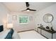 Bright bedroom featuring a comfortable bed and stylish decor with views to exterior at 1048 Pinehurst Se Dr, Smyrna, GA 30080