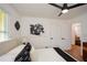 Bright bedroom with fresh paint featuring great natural light, ceiling fan, and modern decor at 1048 Pinehurst Se Dr, Smyrna, GA 30080