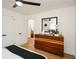 Spacious bedroom featuring a large dresser, fresh paint, great natural light, and modern decor at 1048 Pinehurst Se Dr, Smyrna, GA 30080