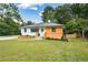 Charming renovated home featuring a freshly painted exterior and landscaped front yard at 1048 Pinehurst Se Dr, Smyrna, GA 30080