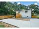 Rear view of renovated home showing the backyard patio and the newly built staircase at 1048 Pinehurst Se Dr, Smyrna, GA 30080