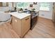 Kitchen island with cooktop and oven at 1048 Pinehurst Se Dr, Smyrna, GA 30080