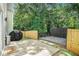 Backyard featuring a deck and well-maintained lawn, perfect for outdoor enjoyment at 2100 Lily Valley Dr, Lawrenceville, GA 30045