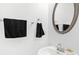Bathroom featuring a sink with a mirror and decorative towels at 2100 Lily Valley Dr, Lawrenceville, GA 30045