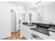 Bright bathroom featuring double sinks and granite countertops at 2100 Lily Valley Dr, Lawrenceville, GA 30045