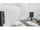 Bathroom featuring a toilet and sink with mirror, creating a clean and functional space at 2100 Lily Valley Dr, Lawrenceville, GA 30045