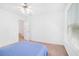 Bedroom featuring carpet flooring, a ceiling fan, and a neutral color scheme, offering a peaceful retreat at 2100 Lily Valley Dr, Lawrenceville, GA 30045