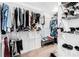 Organized walk-in closet with shelves and hanging racks, offering ample storage space at 2100 Lily Valley Dr, Lawrenceville, GA 30045