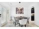Cozy dining room with modern chandelier, round table, and stylish decor adjacent to the kitchen at 2100 Lily Valley Dr, Lawrenceville, GA 30045