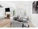 Cozy dining area with modern lighting, round table, and open to the living room and fireplace at 2100 Lily Valley Dr, Lawrenceville, GA 30045