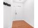 Bright foyer with hardwood floors, white walls, and minimalist decor; perfect for a modern entrance at 2100 Lily Valley Dr, Lawrenceville, GA 30045