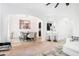 Open-concept living space featuring dining, and living areas, with sleek decor and modern lighting at 2100 Lily Valley Dr, Lawrenceville, GA 30045