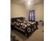 Simple bedroom with a bed, a nightstand, and a window with curtains on a sunny day at 2545 Melville Pl, Powder Springs, GA 30127