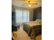 Bedroom featuring a bed, chair, large window and carpeted flooring at 2545 Melville Pl, Powder Springs, GA 30127