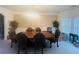 Dining room with a large wooden table, chandelier, and wainscoting details at 2545 Melville Pl, Powder Springs, GA 30127