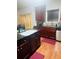 The kitchen features wooden cabinets and countertops, a black sink, a stainless steel dishwasher, and wood floors at 2545 Melville Pl, Powder Springs, GA 30127