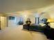 Spacious main bedroom featuring sitting area, ceiling fan and carpeted flooring at 2545 Melville Pl, Powder Springs, GA 30127