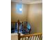 View from the staircase showcasing railing, front door, foyer, and natural light at 2545 Melville Pl, Powder Springs, GA 30127