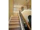 Carpeted staircase with decorative wrought iron railing leads to upper level at 2545 Melville Pl, Powder Springs, GA 30127