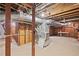 Exposed duct work and beams and unfinished walls in the basement at 357 W Hightower Trl, Social Circle, GA 30025