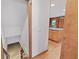 Stairs leading down to the unfinished basement, and view of an eat-in kitchen area at 357 W Hightower Trl, Social Circle, GA 30025