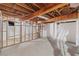 Unfinished basement with exposed beams, block walls, and concrete floors; ready for customization at 357 W Hightower Trl, Social Circle, GA 30025