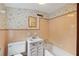 Bathroom with floral wallpaper, vintage tile, and a classic vanity at 357 W Hightower Trl, Social Circle, GA 30025