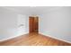Bright bedroom with hardwood floors and a door leading to another room at 357 W Hightower Trl, Social Circle, GA 30025