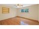 Bedroom featuring hardwood floors, natural light, and built in shelving at 357 W Hightower Trl, Social Circle, GA 30025