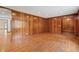 This bright living room features hardwood floors and a seamless transition to other areas of the home at 357 W Hightower Trl, Social Circle, GA 30025