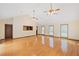 Spacious living room with hardwood floors, plenty of natural light, and ceiling fans at 357 W Hightower Trl, Social Circle, GA 30025