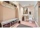 Well-lit bathroom with pedestal sink, storage bench, and step-in shower at 4340 Garmon Rd Nw, Atlanta, GA 30327