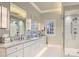 Elegant main bathroom with a double vanity, marble countertops, and a frameless glass shower at 4340 Garmon Rd Nw, Atlanta, GA 30327