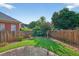Lush backyard with a well-manicured lawn and a beautiful crepe myrtle, perfect for outdoor enjoyment at 2000 Stockton Walk Ln, Snellville, GA 30078