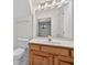 Bathroom with wooden cabinets, a white countertop, and a decorative light fixture at 2000 Stockton Walk Ln, Snellville, GA 30078