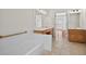 Bathroom with a large vanity area, tub, and tiled floor at 2000 Stockton Walk Ln, Snellville, GA 30078
