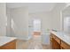 Bright bathroom featuring a walk-in shower, tub, vanity, and tiled floor at 2000 Stockton Walk Ln, Snellville, GA 30078