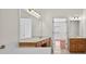 Bright bathroom with double vanity, tub, and tiled floors at 2000 Stockton Walk Ln, Snellville, GA 30078
