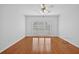Bright bedroom featuring hardwood floors, a ceiling fan, and large windows for natural light at 2000 Stockton Walk Ln, Snellville, GA 30078