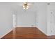 Spacious bedroom featuring neutral walls, hardwood flooring, and a ceiling fan at 2000 Stockton Walk Ln, Snellville, GA 30078