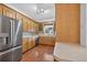 Kitchen featuring stainless steel appliances, wooden cabinets and hardwood floors at 2000 Stockton Walk Ln, Snellville, GA 30078