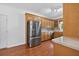 Traditional kitchen with stainless steel appliances, wood cabinets, and hardwood flooring at 2000 Stockton Walk Ln, Snellville, GA 30078