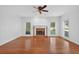 Spacious living area boasting hardwood floors, a classic brick fireplace, and ample natural lighting at 2000 Stockton Walk Ln, Snellville, GA 30078