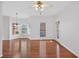 Bright open-plan living room with hardwood floors, lots of natural light, and access to the outdoors at 2000 Stockton Walk Ln, Snellville, GA 30078